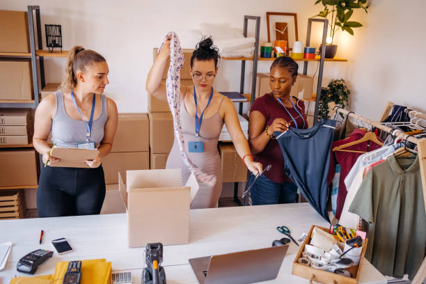 istock Picking and preparing clothes for delivery service 1592612969