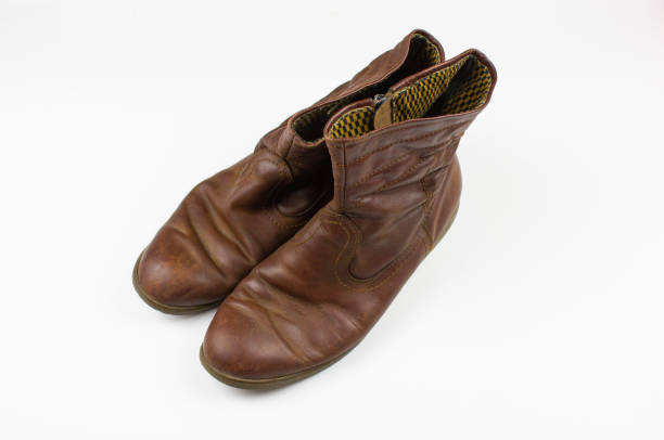 istock Vintage short boots.Old leather half boots.Brown boots old-fashioned on a white isolated background. 1592623548