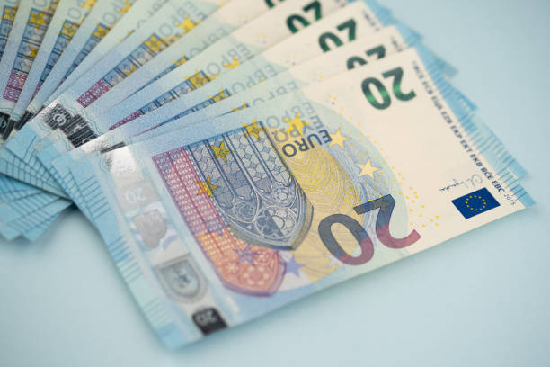 istock many 20 euro bills on a blue background 1592641019