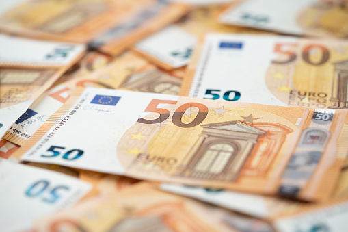 many 50 euro bills close-up mixed haphazardly