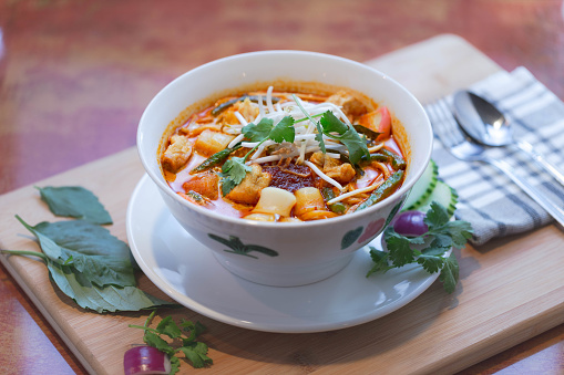 Southeast Asian Food of Curry Laksa with veggie and seafood
