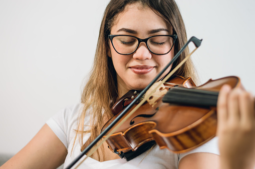 close up portrait of young latin female violinist