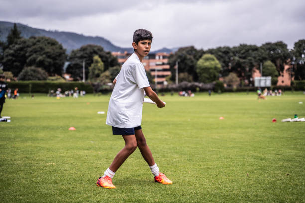 istock Child throwing a frisbee at the public park 1592660251
