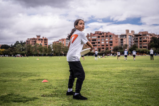 Child throwing a frisbee at the public park