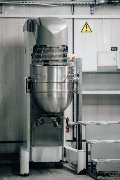 istock Industrial mixer of raw solution for preparing marshmallows in confectionery 1592666060