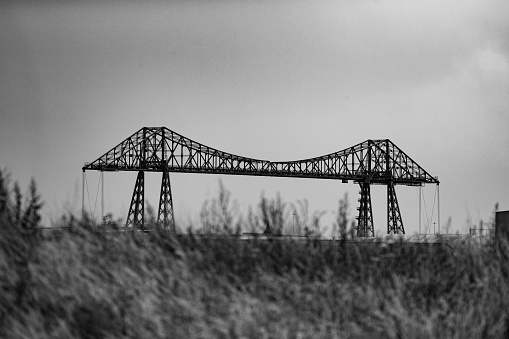 Black and white picture of the Transporter Bridge in Middlesbrough, crossing the river Tees