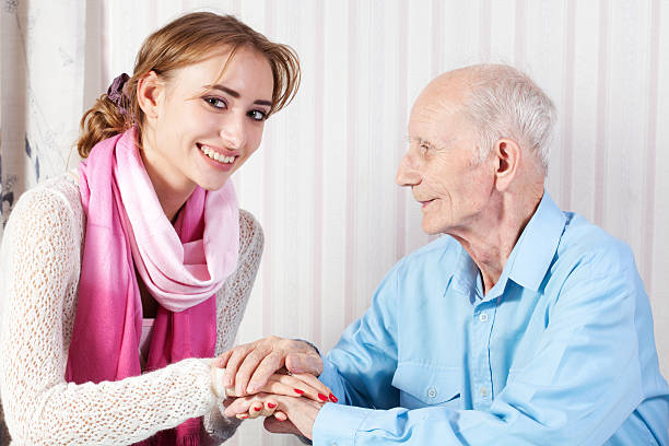 istock Senior man with her caregiver at home 159267414