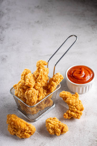 istock Breaded chicken strips. Chicken fingers. 1592731650