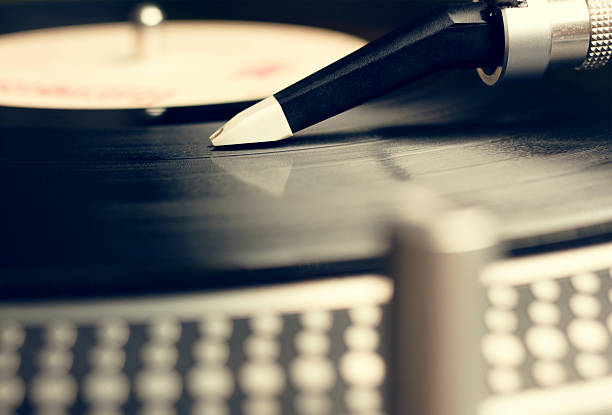 istock Old fashioned turntable playing a track from black vinyl 159277079
