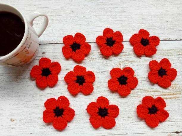 istock Crochet Daisy Pattern Fall Autumn Leaves Flowers Multi-color Handmade Background Texture 1592788101
