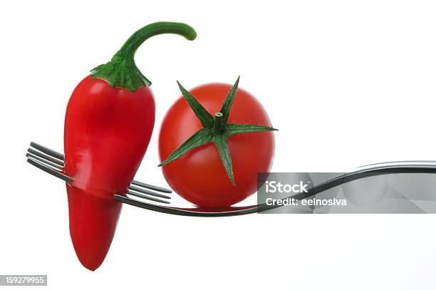 Chili Pepper And Tomato On A Fork Stock Photo - Download Image Now - Cherry Tomato, Chili Pepper, Food