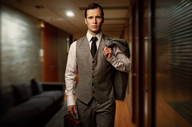 istock Man with briefcase in a hotel hallway 159280265