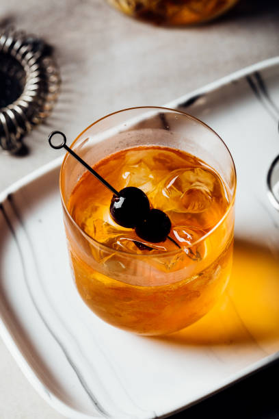 istock Booze Bourbon whiskey Manhattan Cocktail on the rocks 1592805652