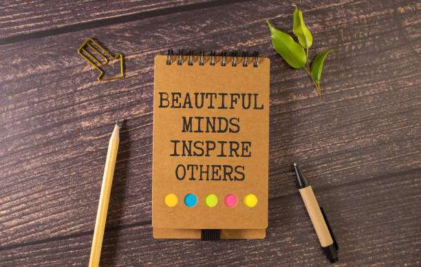 istock a notebook with Beautiful Minds inspire others on it. 1592808255