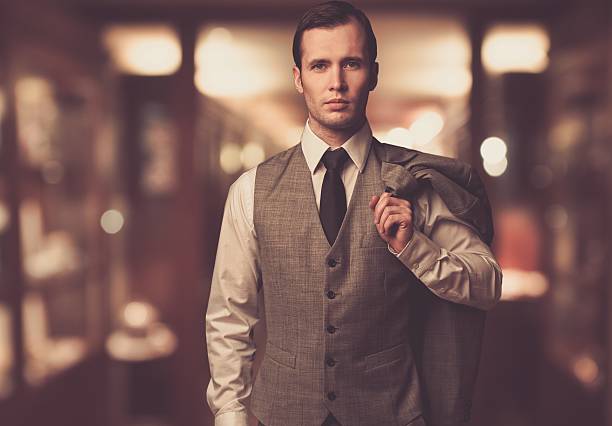 istock Man in waistcoat with jacket over his shoulder 159282187