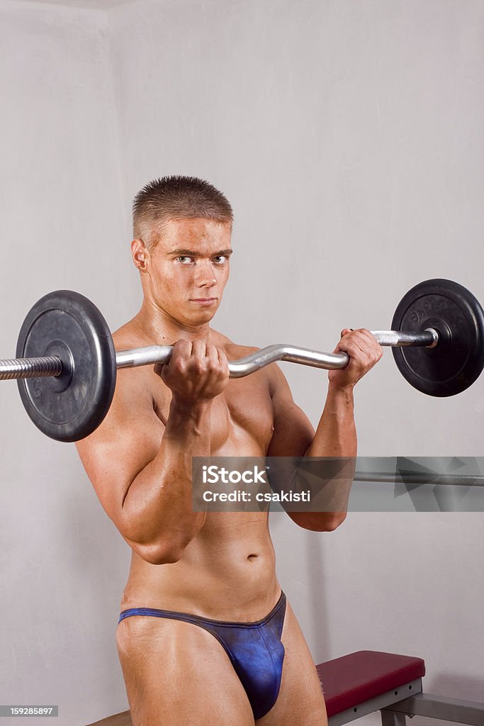 amateur bodybuilder training novice bodybuilder training his bicep Adult Stock Photo