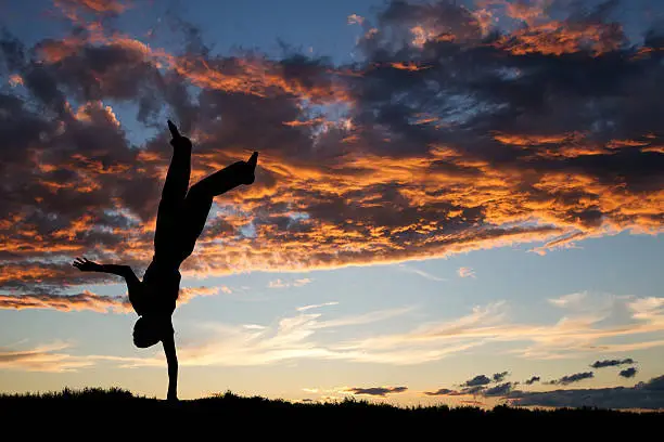 Photo of handstand in sunset