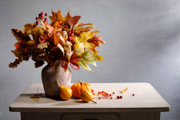 Autumn leaves bouquet with pumpkins