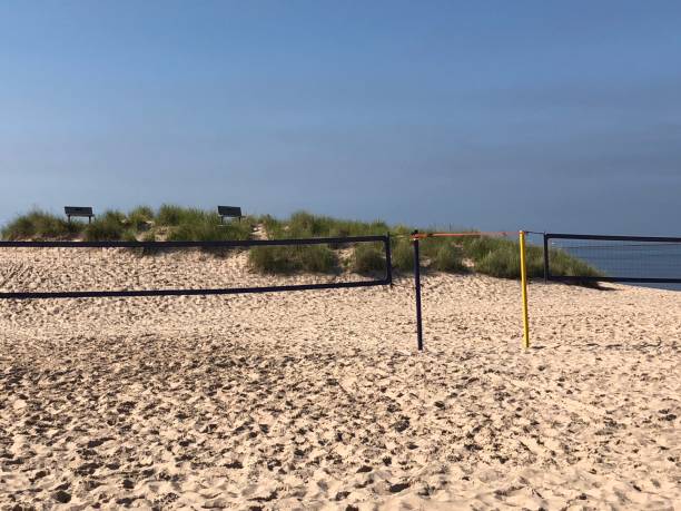istock Frankfort, Michigan sandy beach with volleyball nets. 1592950910