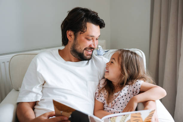 istock Father and daughter enjoying at home 1592959574