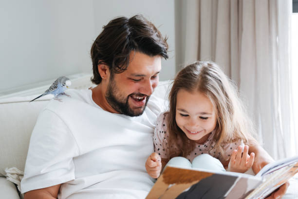 istock Father and daughter enjoying at home 1592964802
