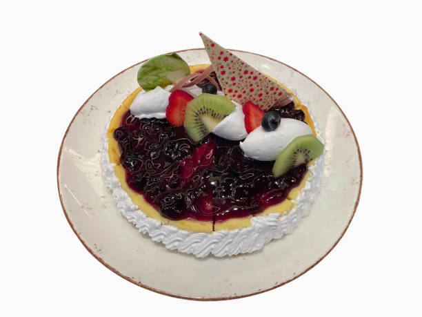 Blueberry Cake with Kiwi, Fresh Strawberries and Whipped Cream on Top.