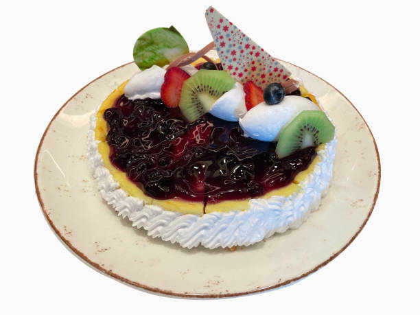 Blueberry Cake with Kiwi, Fresh Strawberries and Whipped Cream on Top.