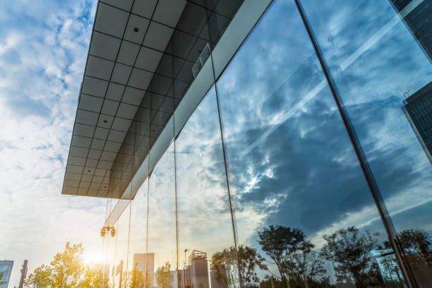 istock Reflection of architecture on modern office building 1593003229