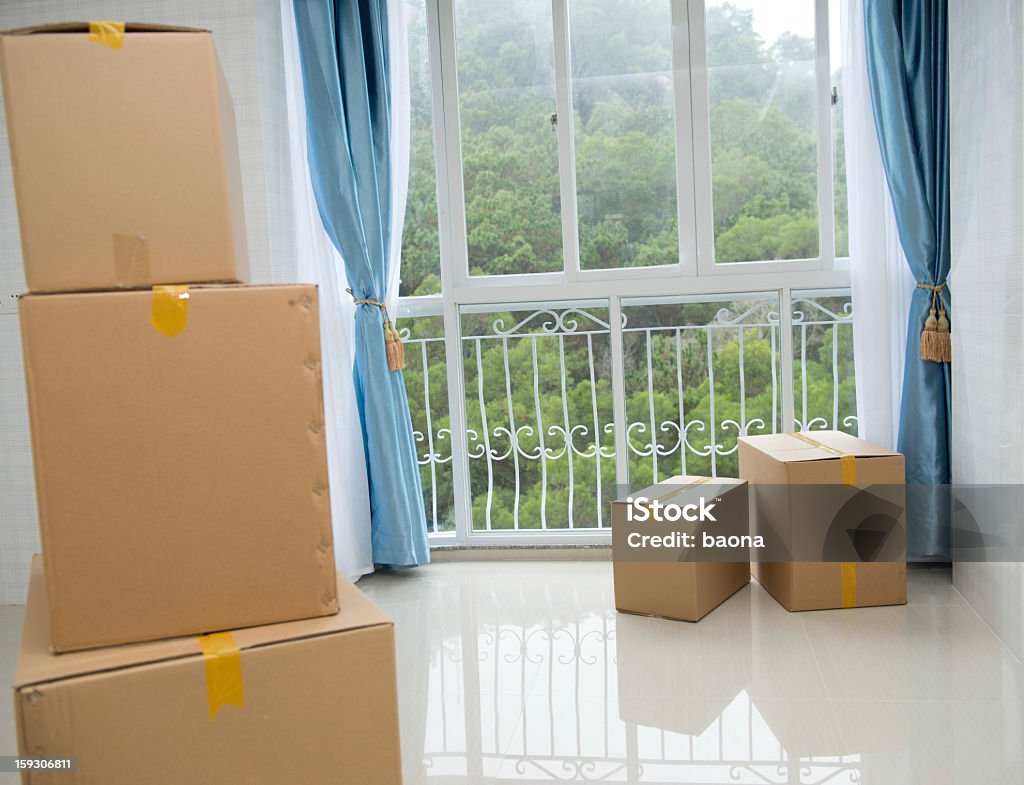 cardboard boxes Cardboard boxes stacked in the  new house. Apartment Stock Photo