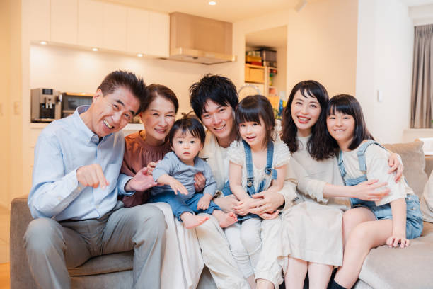 istock Smiling three-generation family group photo 1593071558