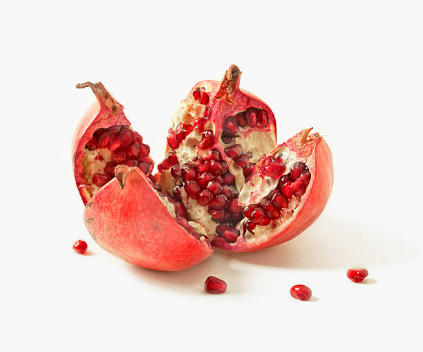 pomegranate on a white background with grains stock photo