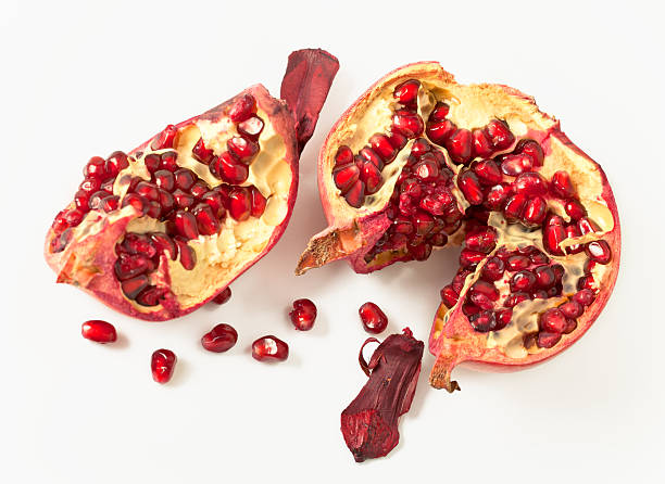 pomegranate on a white background with grains stock photo