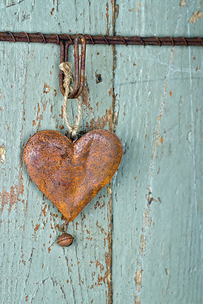 istock Old rusty heart on wooden background 159308932