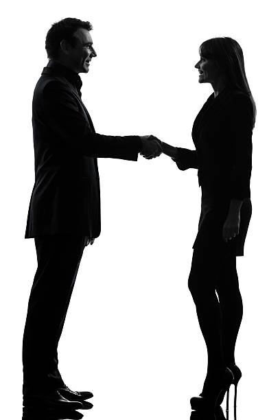 casal de homem silhueta de mulher de negócios - isolated smiling business person handshake - fotografias e filmes do acervo