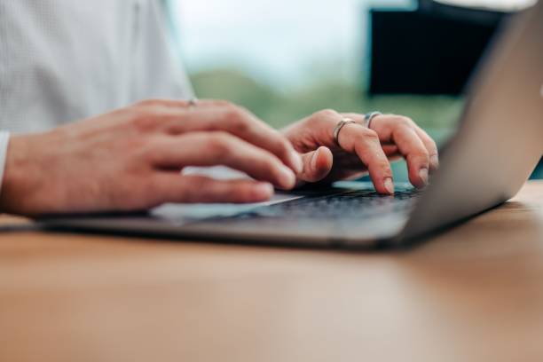 istock businessman typing something on his keyboard 1593125572