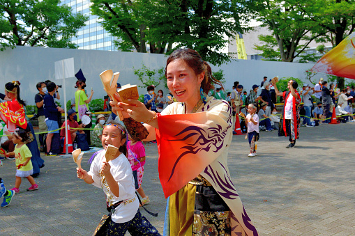 Tokyo, Japan-August 27, 2022:\nHarajuku-Omotesando Genki Matsuri Super Yosakoi was held in Harajuku and Yoyogi Park area, Tokyo, on the last weekend of August this year, after 2 years' absence due to the COVID-19 Pandemic. Men and women, young and old, performed very vibrant dancing in Super Yosakoi Parade..\nYosakoi is one of the most popular dance festivals in Japan, which originated in Kochi City, Shikoku Island, in 1954, and takes place for four days, including the eve of festival, from August 9 to 12 each year. Ever since, Yosakoi has become popular throughout Japan and Yosakoi festivals are now held all over throughout the year.