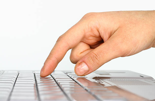 closeup of a hand about to press on a keyboard - computer delete bildbanksfoton och bilder