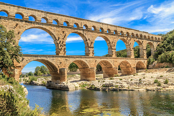 Daytime at the Pont du Gard in Provence, France Pont du Gard is an old Roman aqueduct near Nimes in Southern France roman empire stock pictures, royalty-free photos & images