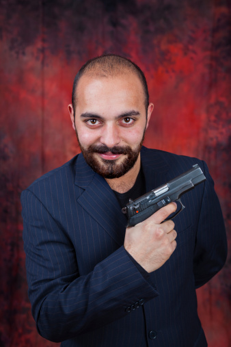 Man posing with a gun