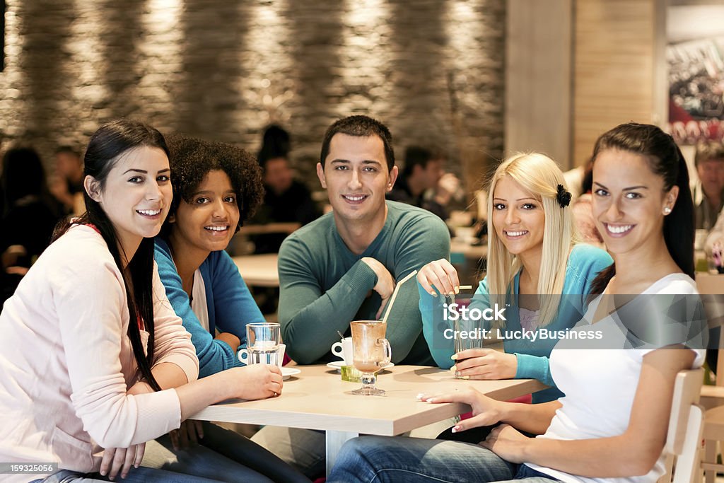 Group of teenagers in cafe Group of teenagers in cafe, students leisure activities leisure activities Adolescence Stock Photo