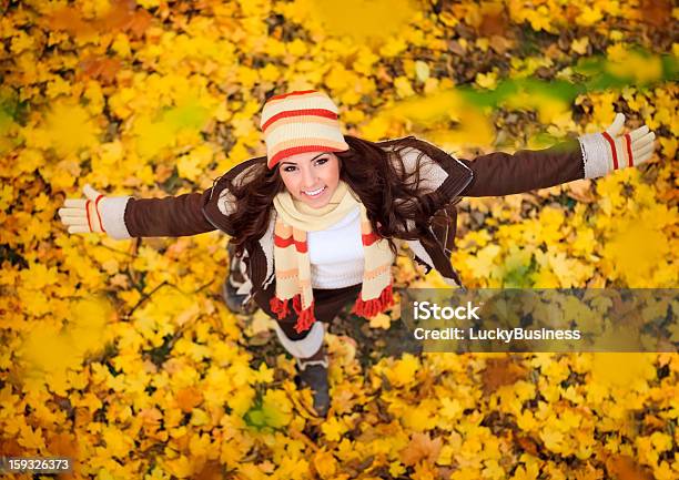 Happy Woman Playing In Autumn Stock Photo - Download Image Now - Adult, Autumn, Beautiful People