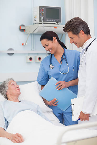 istock Elderly patient talking to a doctor and nurse 159329128