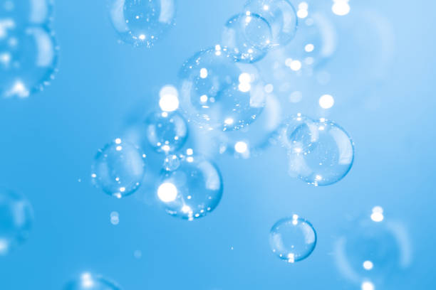 istock Beautiful Transparent Shiny Blue Soap Bubbles Floating in The Air. Abstract Background, Blue Textured, Celebration Festive Backdrop, Refreshing of Soap Suds, Bubbles Water. 1593300806