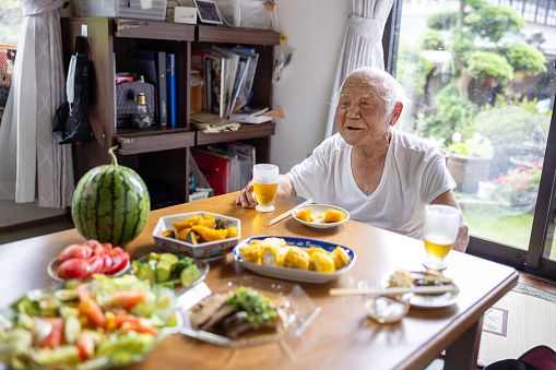 Senior man having lunch at home
