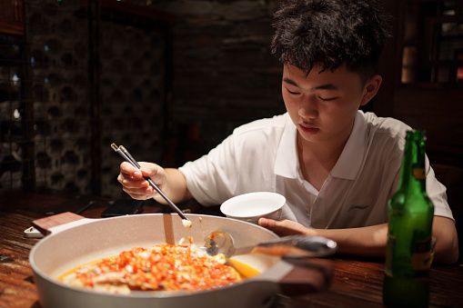 man enjoying chinese food