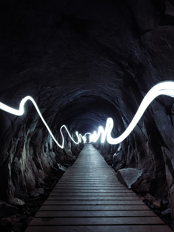 Light painting in a whole of a mountain.