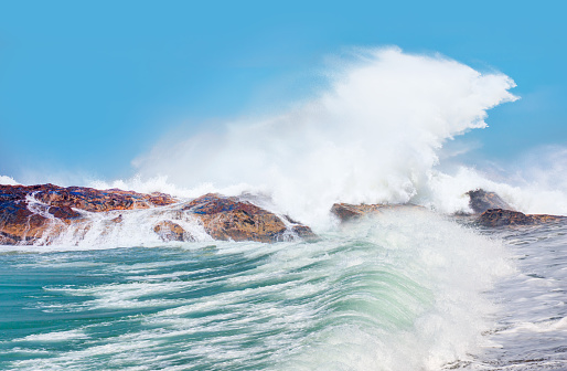 Panorama of a huge storm wave crashing on the rocks. Location: Porto, west coast of Corsica, France.