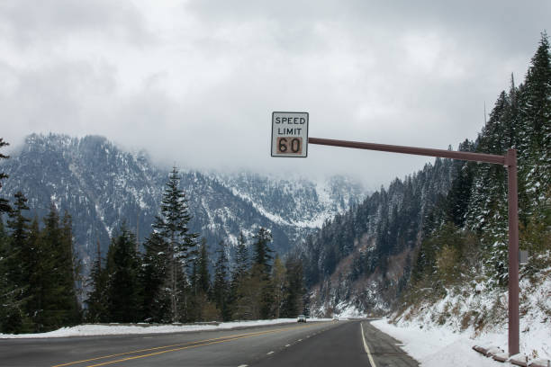 Speed limit road sign over a mountain highway
