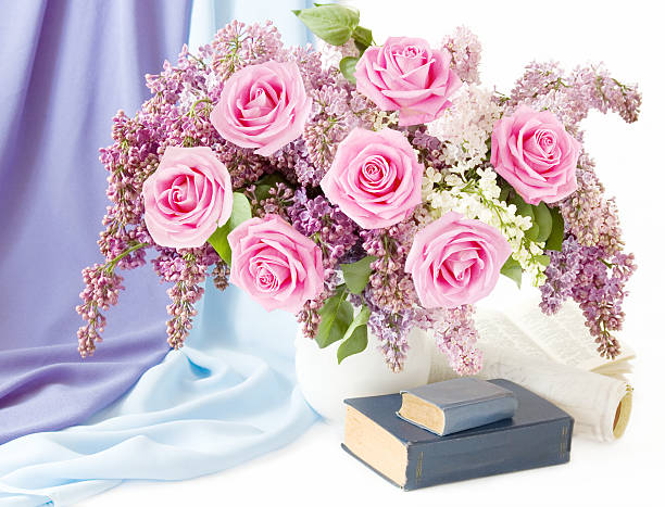 Still life with flowers bunch and books stock photo