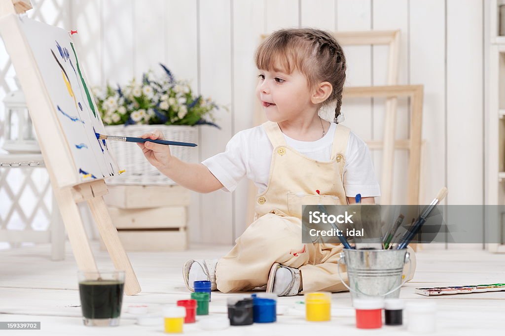 Girl-artist Little girl artist paints in his studio Painting - Activity Stock Photo